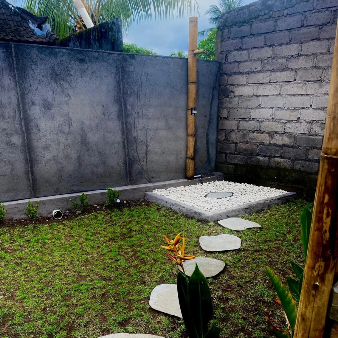 Garden shower with river stones
