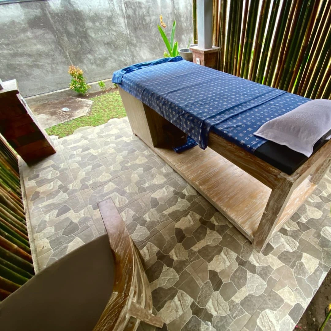 Outdoor treatment bed in a Balinese garden